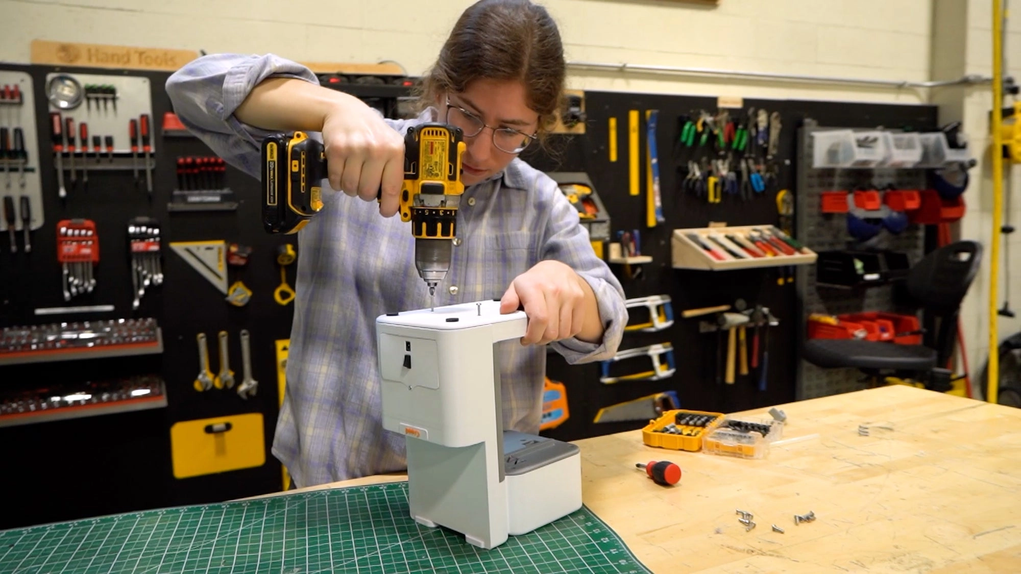 An engineer assembling a Sidekick prototype in the workshop