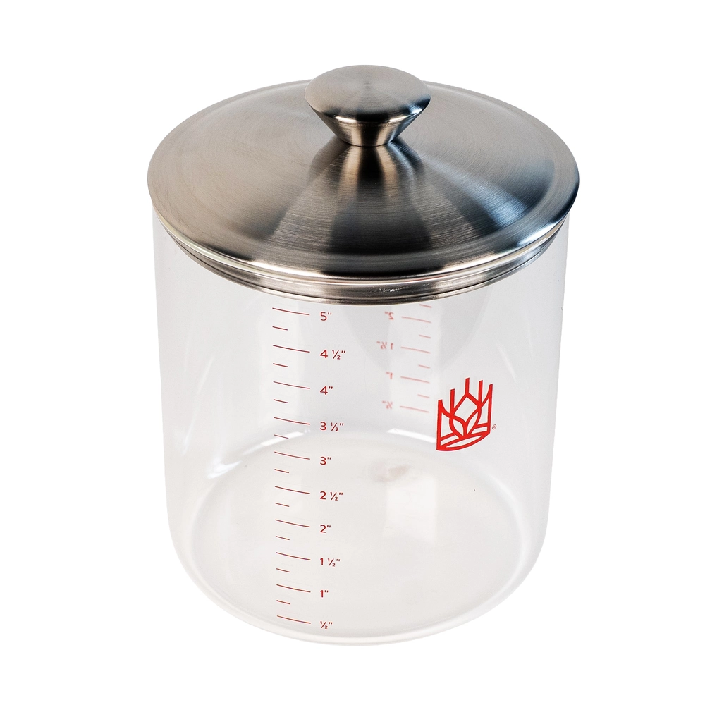 The glass crock seen from above with its metal lid on